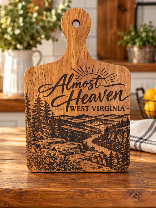 Almost Heaven West Virginia laser engraved wooden cutting board with mountain and forest scenery