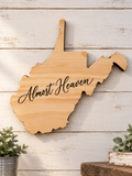 West Virginia-shaped wooden wall art engraved with Almost Heaven script