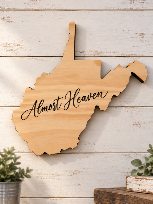 West Virginia-shaped wooden wall art engraved with Almost Heaven script