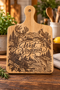 West Virginia wildlife laser engraved wooden cutting board featuring a deer, cardinal, black bear, trout, mountains, and West Virginia script
